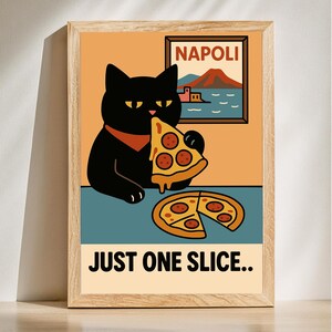 May include: Framed art print showing a black cat with a red scarf, eating pizza. A whole pizza and a Naples scene are also depicted. The text at the bottom of the print reads "JUST ONE SLICE.."
