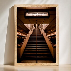 May include: A framed photograph of a set of stairs leading up to a light at the end of a tunnel. The sign above the stairs reads "If you don't know what you want, there is no exit."