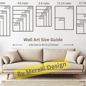 May include: A guide for choosing the right size wall art for a sofa that is 85 inches wide. The guide shows different aspect ratios and corresponding sizes in inches and centimeters. The text "Wall Art Size Guide" and "sofa size is 85 in (216cm)" is visible at the top of the image. The text "By Meraki Design" is visible at the bottom of the image.