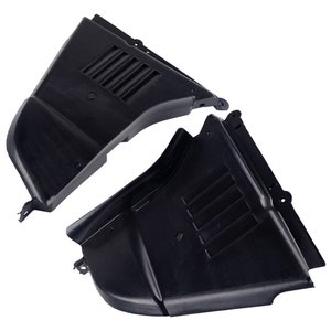 May include: Two black plastic automotive parts. Each part has a curved shape with a series of parallel vents. The parts are designed to fit together, with mounting tabs visible on the edges. The parts are made of a durable, matte black plastic.