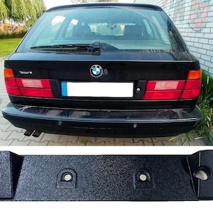 Könnte beinhalten: Schwarzer Kunststoff-Stoßfängerabdeckung Ersatz für einen BMW 5er Touring. Die Abdeckung hat drei Löcher zur Befestigung.