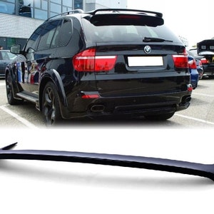 May include: Black rear spoiler for a BMW X5 SUV. The spoiler is made of high-quality ABS plastic and is designed to improve the car's aerodynamics and handling.