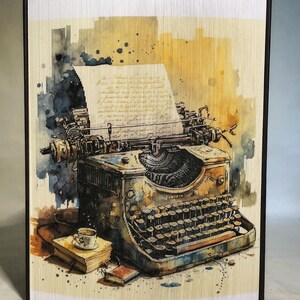 May include: A vintage typewriter with a sheet of paper in it, a cup of coffee, and two books on a table. The typewriter is painted in a watercolor style with a yellow and brown background.
