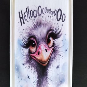 May include: A colorful book art sculpture of an ostrich with long eyelashes and the text "Hellooooooo" above it.