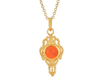 May include: A gold necklace with a pendant featuring an orange gemstone set in a detailed, ornate gold frame.