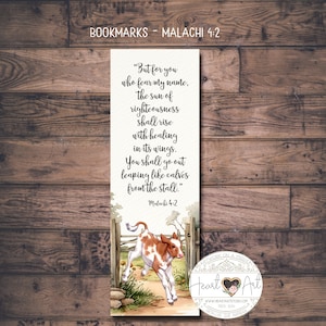 May include: Bookmark with text from Malachi 4:2, featuring a watercolor illustration of a calf leaping from a stall. The bookmark has a cream background with a brown and white calf, a wooden fence, and green grass.
