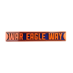 May include: A blue and orange sign with the text "WAR EAGLE WAY" in orange letters.
