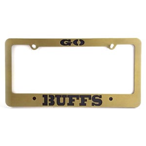 May include: A set of three ceramic mugs with a speckled, matte finish. The mugs are in shades of cream, light gray, and dark gray. Each mug has a simple, minimalist design and a rounded handle. The mugs are stacked on top of each other.