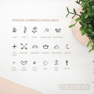 May include: A black and white graphic showing a variety of symbols, including a leaf, rose, butterfly, plus sign, arrows, rainbow, crown, mountain, moon, heart, star, sun, pine tree, and cross. The text "SPECIAL SYMBOLS AVAILABLE" is at the top of the image.
