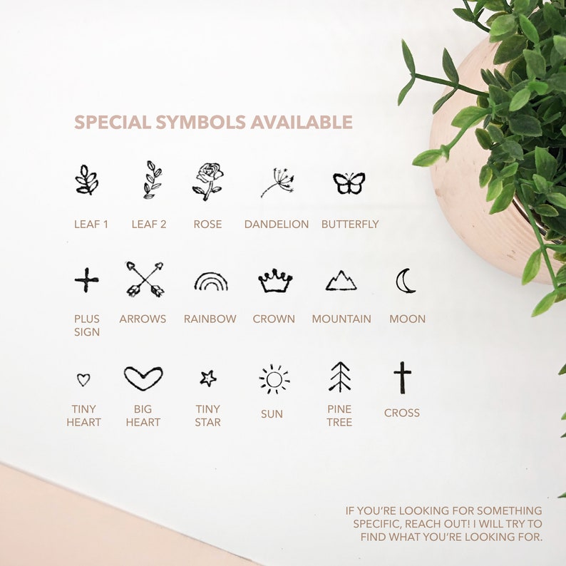 May include: A black and white graphic showing a variety of symbols, including a leaf, rose, butterfly, plus sign, arrows, rainbow, crown, mountain, moon, heart, star, sun, pine tree, and cross. The text "SPECIAL SYMBOLS AVAILABLE" is at the top of the image.