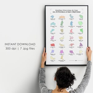 May include: A framed poster displaying a map of the Democratic Republic of the Congo, detailing its 26 provinces and their capitals. The poster is in a black frame and is held up by a person. The poster includes the text "INSTANT DOWNLOAD" and "300 dpi | 7 Jpg files."