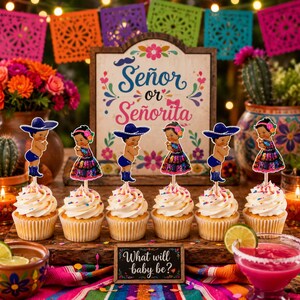 May include: Cupcakes with white frosting and colorful sprinkles, topped with decorative cutouts of a boy and girl in traditional attire. A sign reads "Señor or Señorita" and "What will baby be?" Festive decorations and drinks complete the scene.