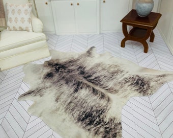 Dollshouse Miniature Faux animal print rug/faux cowhide for one twelfth scale roomboxes, dioramas and dollshouses.