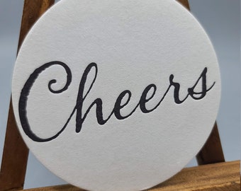 Letterpress printed set of 16 black CHEERS Coasters