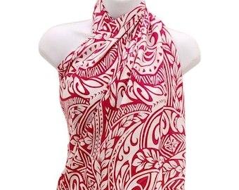 May include: A red and white sarong with a Polynesian-inspired pattern. The sarong is made of a soft, flowing fabric and can be worn in a variety of ways.