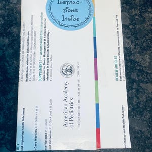 May include: A white and blue journal cover with the text "American Academy of Pediatrics" and "Dedicated to the Health of All Children". The cover also features a blue circle with the text "Instructions Inside".