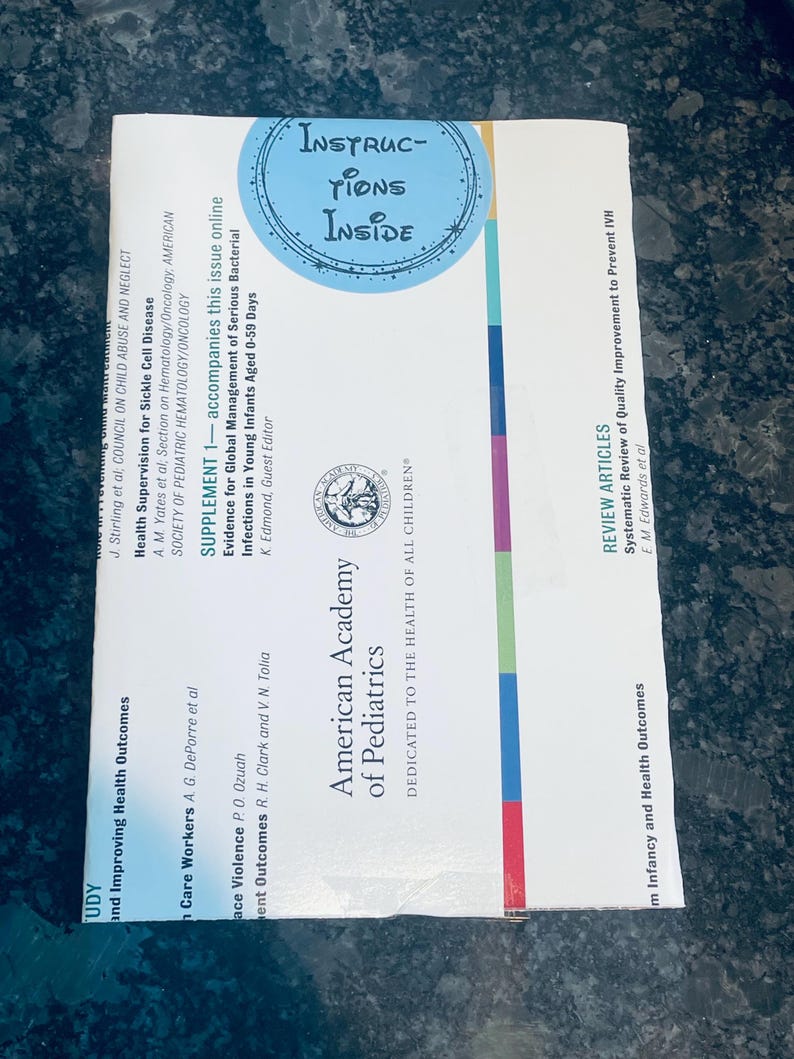 May include: A white and blue journal cover with the text "American Academy of Pediatrics" and "Dedicated to the Health of All Children". The cover also features a blue circle with the text "Instructions Inside".