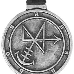 May include: A silver pendant with a sigil and the letters "ABADDON" inscribed around the edge.