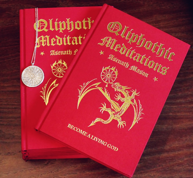 May include: Two red hardcover books with gold lettering titled "Qliphothic Meditations" by Asenath Mason. The book on the right has a gold dragon illustration and the text "Become a Living God".