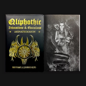 May include: A black leather-bound book with gold lettering titled "Qliphothic Invocations & Evocations" by Asenath Mason. The cover features a gold illustration of a circle with a star inside, surrounded by two winged creatures. The text "Become a Living God" is printed below the illustration.
