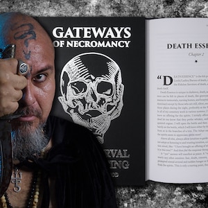 May include: A black and white book with the title "Gateways of Necromancy" and a chapter titled "Death Essence". The book is open to a page with text about the "Death Essence" and its connection to the spirits of the dead. A man with a beard and tattoos is holding a dagger in front of his face, looking directly at the camera.