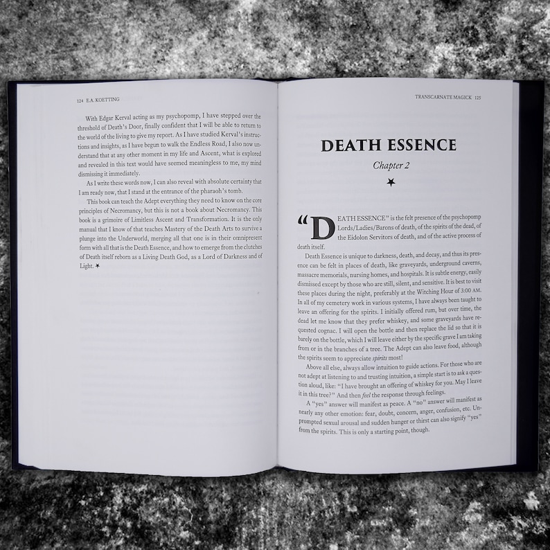 May include: Open book with a white background and black text. The title of the book is "Death Essence" and the chapter is "Chapter 2". The text on the page discusses the concept of "Death Essence" and how it is felt in places of darkness, death, and decay. The text also mentions the importance of offering spirits whiskey or cognac as an offering.