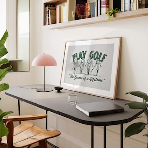 Vintage style horizontal golf print. Green halftone retro golf graphic of two men and two women walking on a golf course with their golf clubs. Text:play golf, the game of a lifetime. Beige background. Great gift for husbands and dads, or kids.