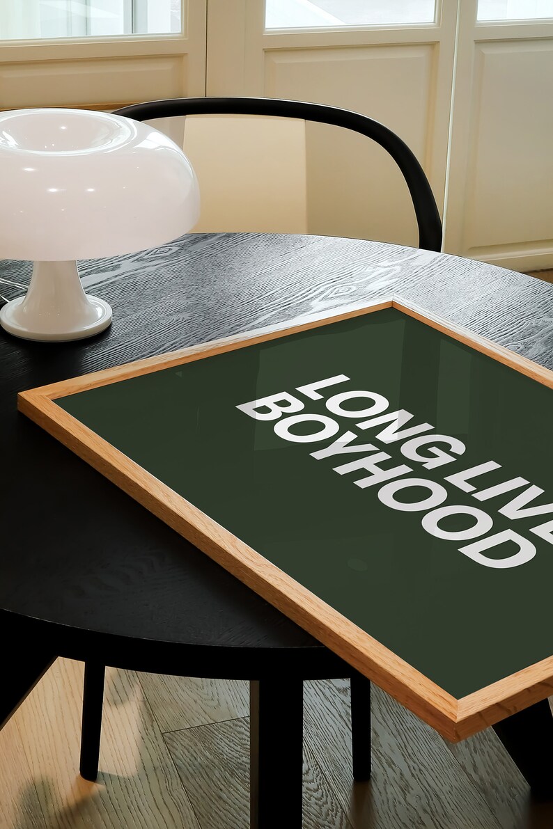 Horizontal long live boyhood print in dark olive green. Green background, white typography in the foreground. Perfect for boys room or nursery.