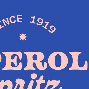 May include: A pink and white logo on a blue background. The logo says "Aperol Spritz" and "Since 1919".
