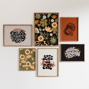 May include: A set of six framed prints with Thanksgiving themes. The prints feature illustrations of turkeys, flowers, and text that says "Happy Thanksgiving", "Let us Eat", and "Autumn Blessings".