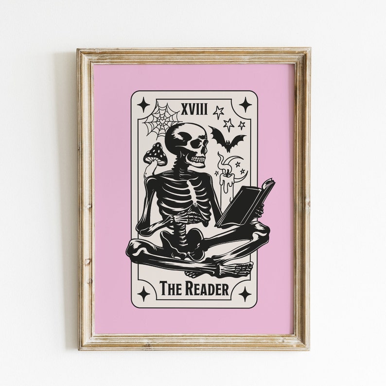 The reader tarot card print. A skeleton reading a book. Pink background, beige and black foreground. Occult witchy reading print. Perfect gift for book lovers.