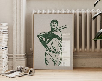May include: A framed print of a vintage illustration of a baseball player in a green silhouette, holding a bat and wearing a cap.