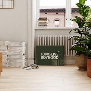 Horizontal long live boyhood print in dark olive green. Green background, white typography in the foreground. Perfect for boys room or nursery.
