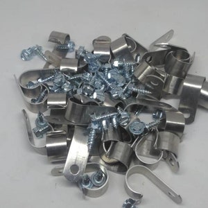 May include: A pile of silver metal pipe clamps and screws. The clamps are designed to hold pipes in place and the screws are used to secure the clamps to a surface.