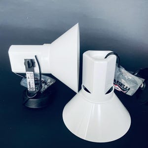 May include: A set of three ceramic mugs with a speckled, matte finish. The mugs are in shades of cream, light gray, and dark gray. Each mug has a simple, minimalist design, perfect for coffee or tea.
