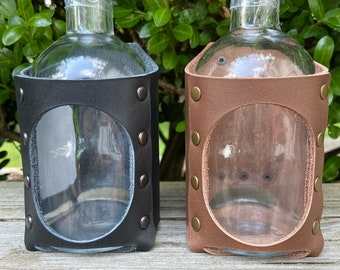 Bottle with belt mounted leather housing