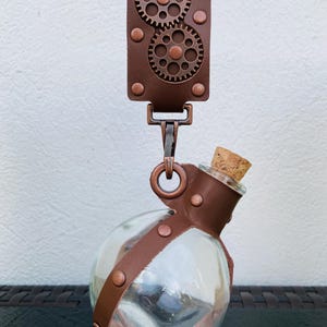 Potion bottle with decorative strap