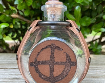 Potion bottle with leather medallion