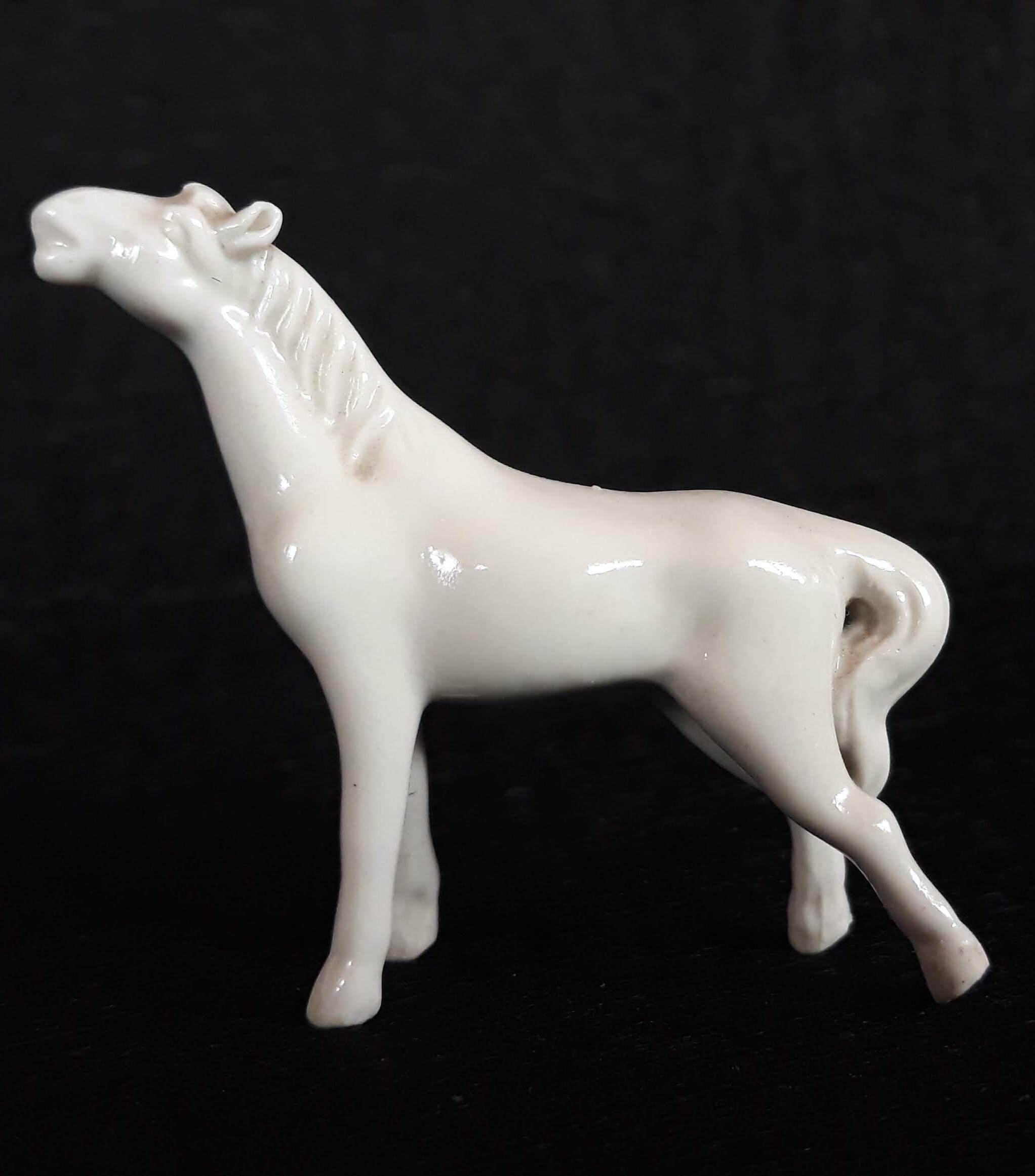 white porcelain horse statue