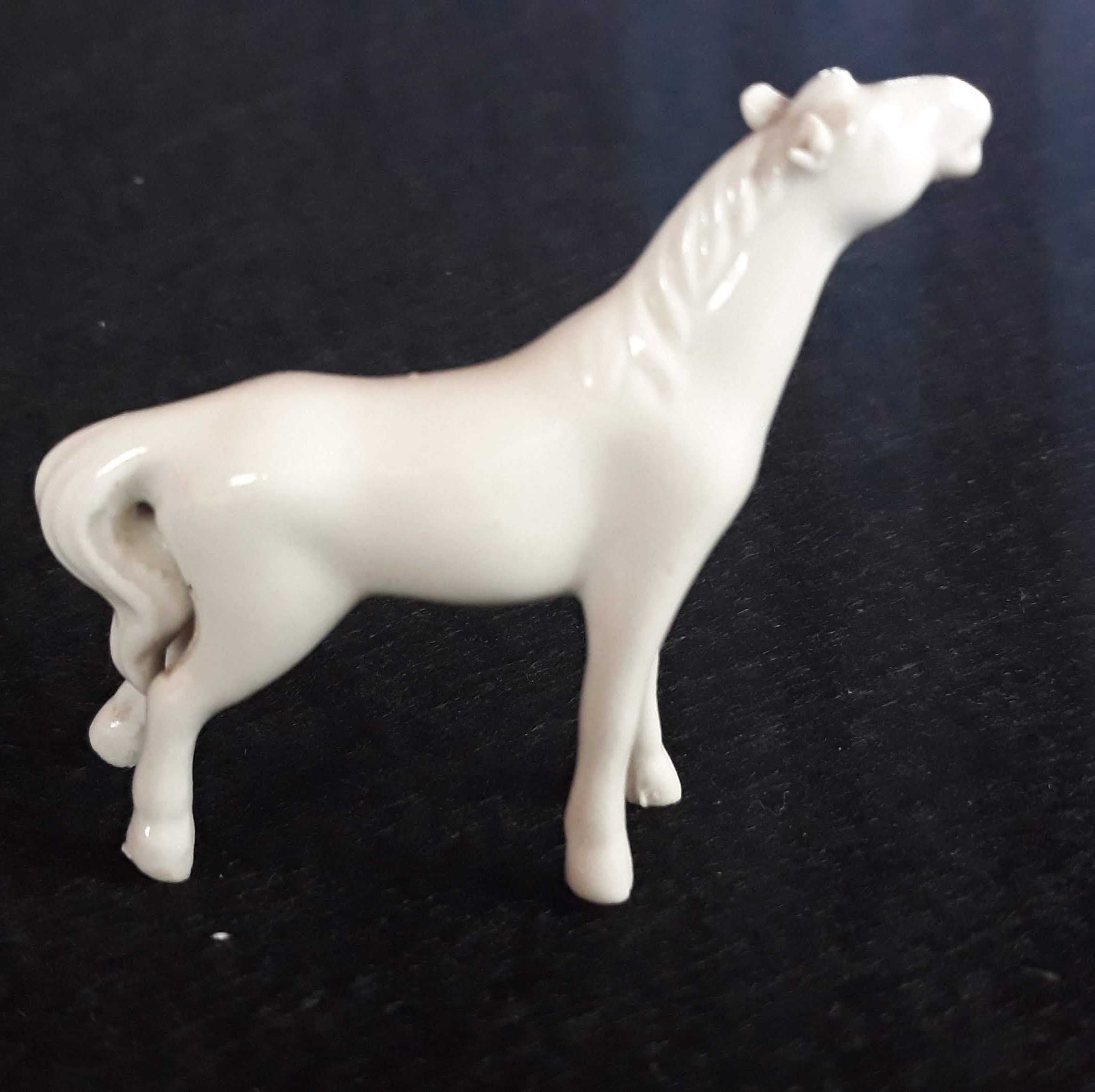white porcelain horse statue