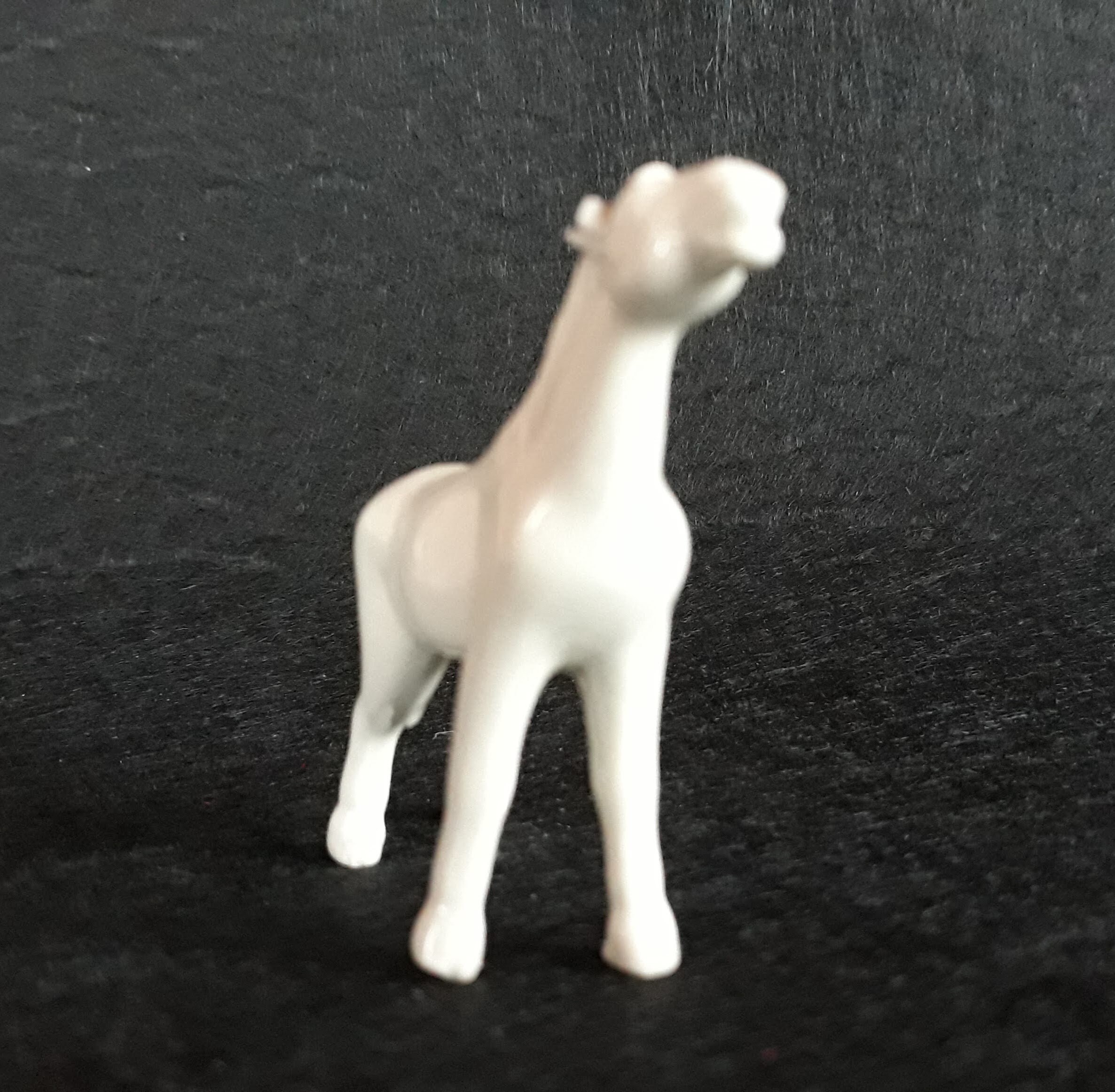white porcelain horse statue