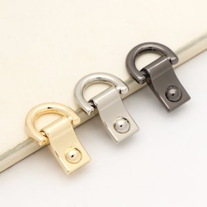 May include: Three metal D-ring swivel clasps in gold, silver, and black.