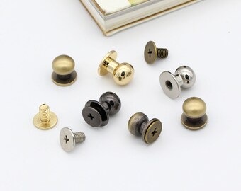 May include: Assortment of metal knobs with screws. The knobs are in various finishes, including gold, silver, and black. The screws are all silver.