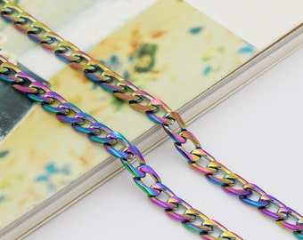 May include: Two rainbow colored curb chains on a white background. The chains are made of metal and have a shiny finish.