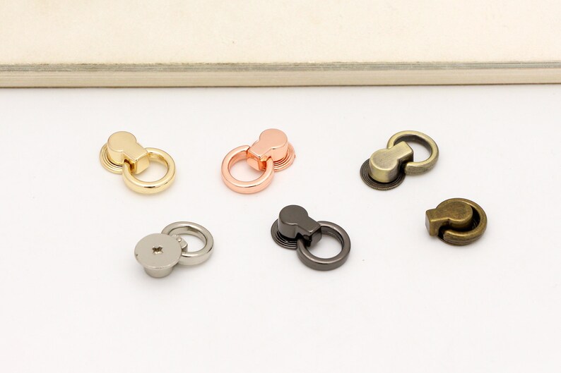 May include: Five different metal ring clasps in gold, rose gold, silver, gunmetal, and antique brass.