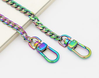 May include: A rainbow-colored metal chain with two lobster clasps. The chain is a curb style and is approximately 18 inches long.