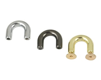 May include: Three metal U-shaped hardware pieces with screw backs. The pieces are silver, black, and gold.