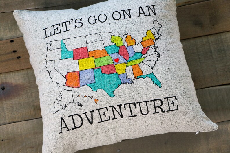 Example of how the DIY Adventure pillow looks with a 18x18 pillow insert and with some states colored in with bright makers.