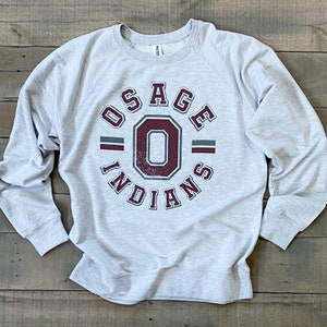 May include: Gray sweatshirt with a maroon and gray graphic print of "Osage Indians" with a large "O" in the center.