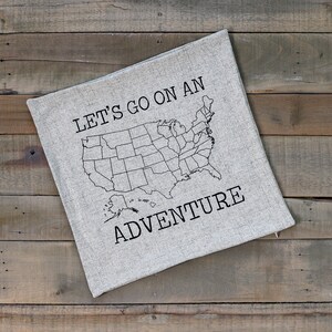 A photo of the product you will receive. 18x18 pillow sham with a zipper opening. Gray/taupe faux linen texture. No states will be colored in. No pillow insert included.